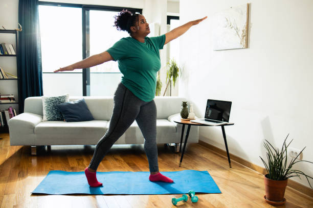 istock Happy young woman exercising 1756917966