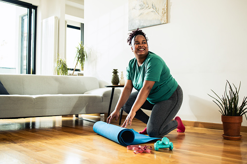 Young woman exercising exercising at home