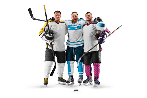 Three professional hockey player. Hockey friendship. Sports portrait. Hockey victory. Young hockey players on a white background. Sport concept. Isolated