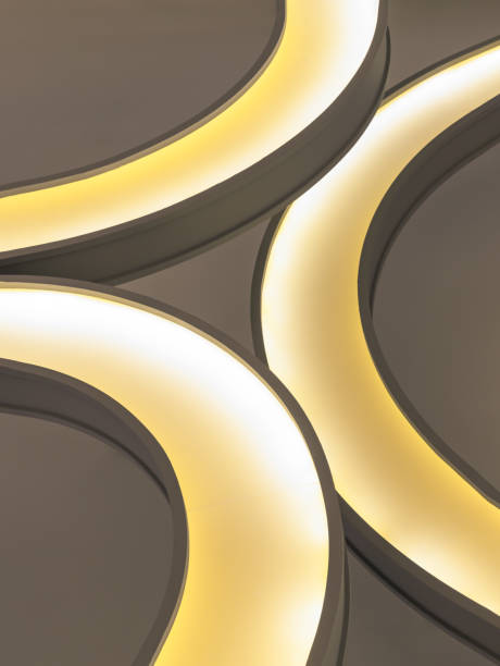 The interior modern round lamp fixtures when looking up to the ceiling illuminate warm light room.
