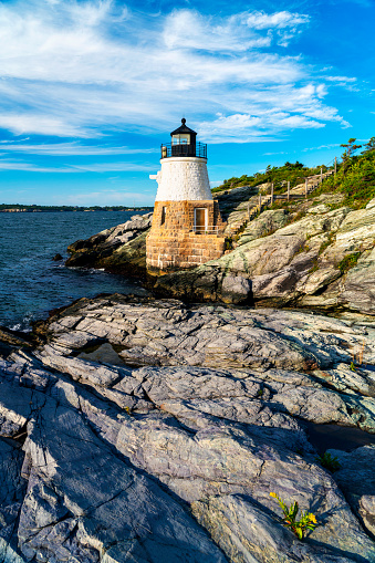 Castle Hill Lighthouse in Newport, Rhode Island on a sunny day.