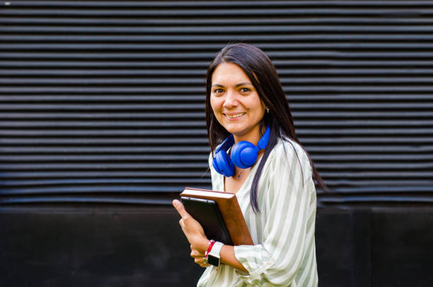 istock middle aged woman studying with tablet online outdoors 1756966204