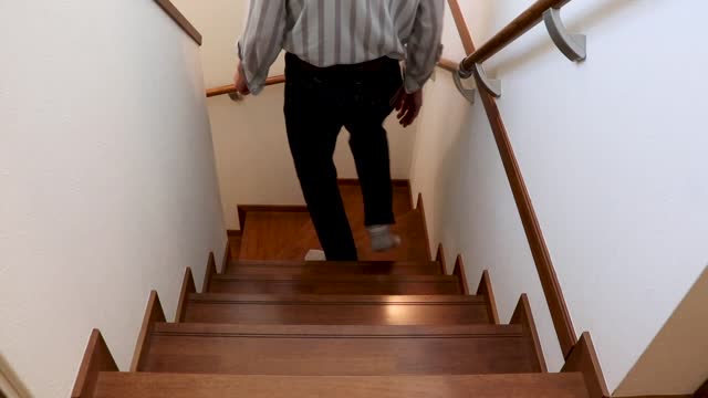 man going down the stairs