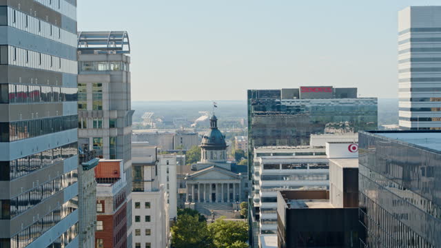 Business district in Columbia, SC: modern skyscrapers surround the State House on Main Street in the capital city of South Carolina. Aerial footage with ascending camera motion