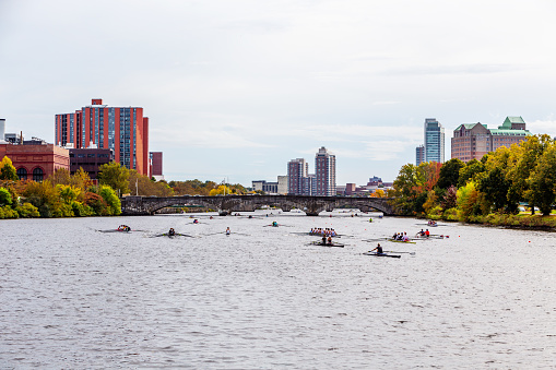 Cambridge, Massachusetts, USA - October 20, 2023: The Head of the Charles Regatta, also known as HOCR, is a rowing head race held on the penultimate complete weekend of October each year on the Charles River, which separates Boston and Cambridge, Massachusetts. It is the largest 3-day regatta in the world, with 11,000 athletes rowing in over 1,900 boats in 61 events.  View toward the River Street Bridge, with the Cambridge on the left and Boston on the right.