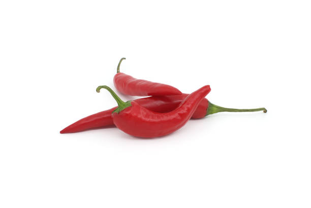 istock Group of red chili peppers isolated on white 1757088391