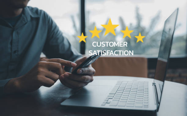 istock Man using smartphone and laptop computer to rate and evaluate services 1757110640
