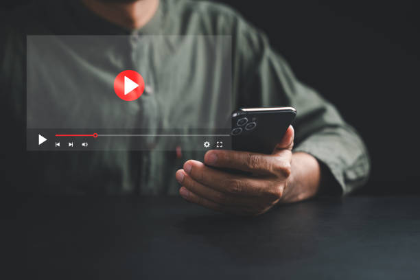 istock Man enjoying video streaming on virtual screen with a smartphone 1757110663