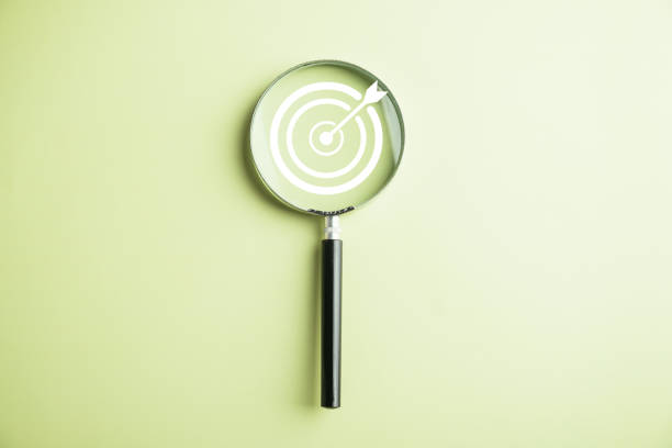 istock Target board inside magnifier glass for focus business objective 1757110671