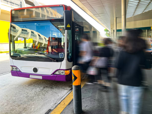 istock Passengers boarding and alighting from a bus at the bus stop. 1757149774