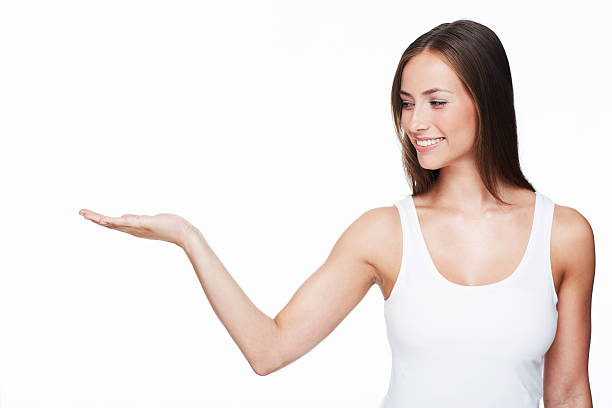 istock Young woman with arm out against white background 175715095