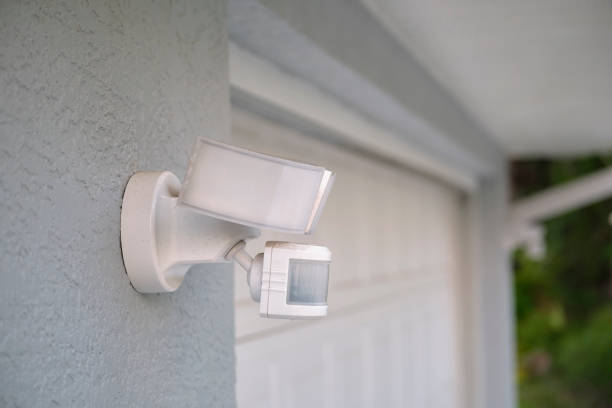 istock Motion sensor with light detector mounted on exterior wall of private house as part of security system 1757154520