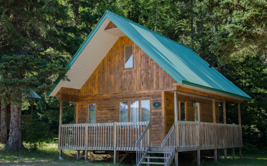 Beautiful wooden house in the forest in Canada. Dream house.