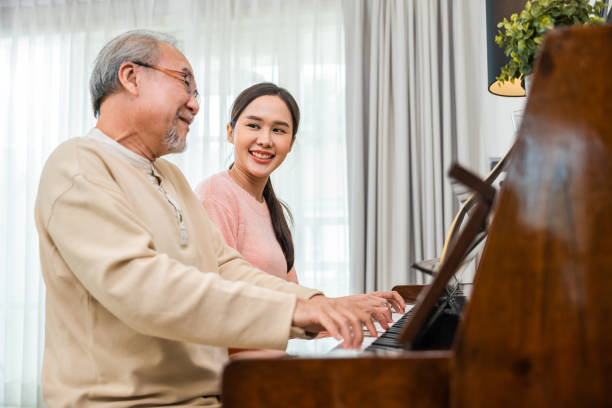 istock Young woman teaching piano for senior man teaching 1757188455