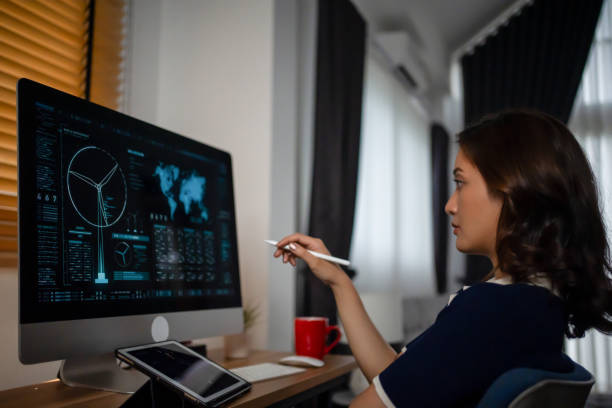 istock Futuristic women Engineer working with Holographic Augmented Reality and 3D Wind Turbine Model on computer and tablet at home office ,Concept of technology and environment 1757193259