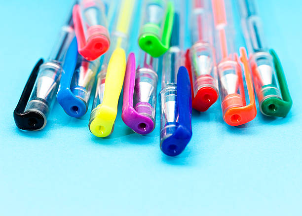 istock Multicolored bright ballpoint pens on blue with copy space 175719946