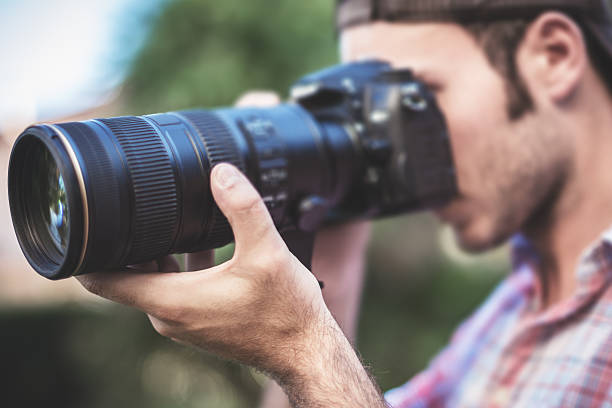 istock Photographer taking a picture with long lens 175720093
