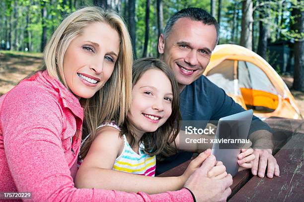 Wireless Technologies In The Camping Stock Photo - Download Image Now - 40-49 Years, 50-59 Years, Adult