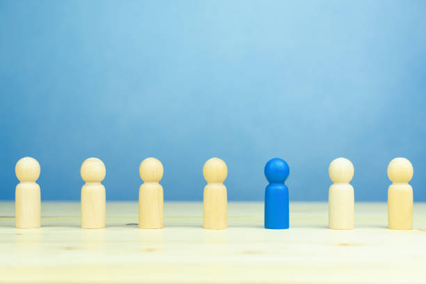 istock Businessman with new ideas creativity, innovative, solution and business success concepts with blue wooden figure person are different from others on table, blue background 1757218058