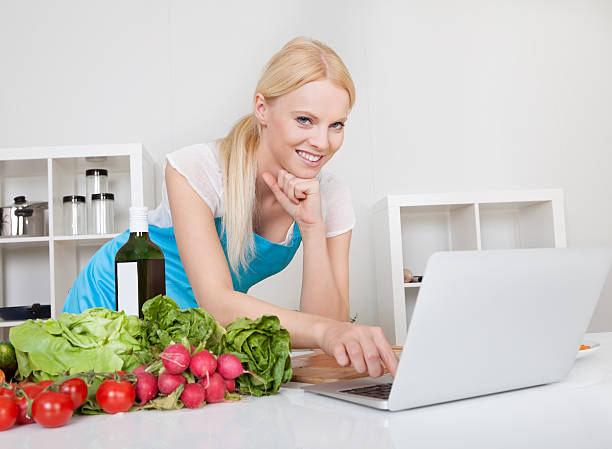 istock Cheerful young woman cooking 175723452
