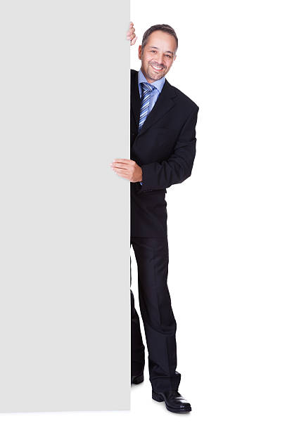 istock Happy Businessman Holding Blank Billboard 175724112