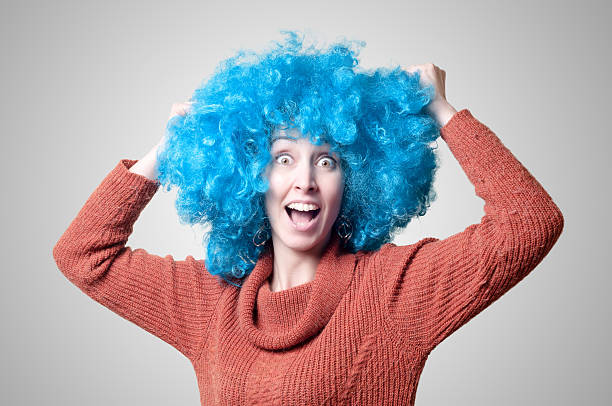 istock beautiful girl with curly blue wig and turtleneck 175724558