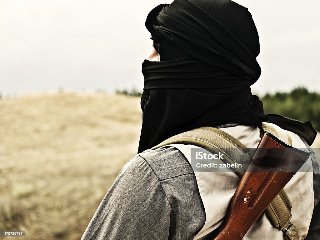 Muslim rebel Muslim rebel with automatic rifle and machine-gun belt Islam Stock Photo