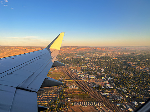 View From a Commercial Airplane Window of Grand Junction, Colorado and the Colorado National Monument at Sunrise in the Summer