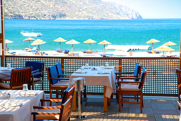istock Outdoor restaurant at the beach terrace (Crete, Greece ). 175730099