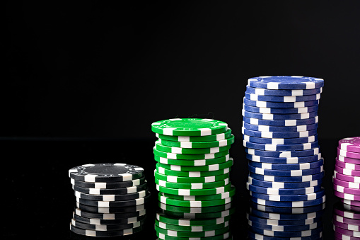 Poker chips on black background studio shot close up
