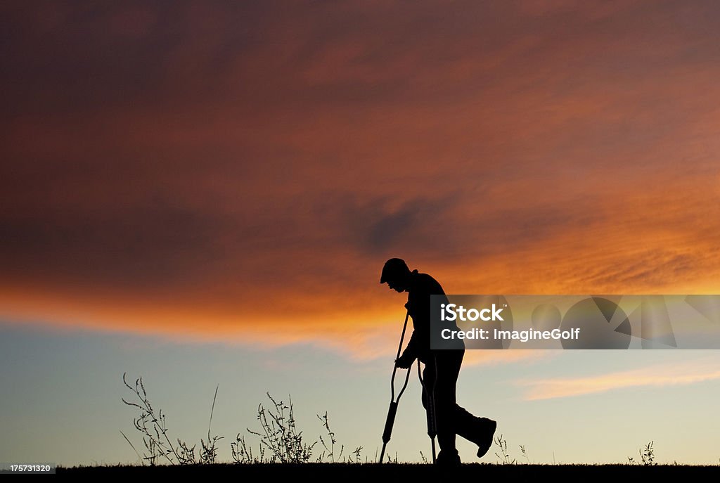 Silhouette of a Senior Man With Crutches A silhouette of an injured senior man with crutches. Medical theme. 60-69 Years Stock Photo