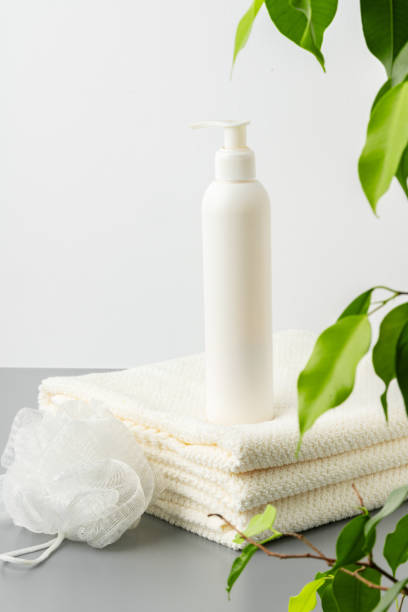 istock White cosmetics container mockup with towels on gray background 1757317657