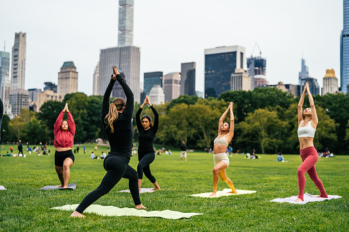 Exercising yoga in Central Park in NYC