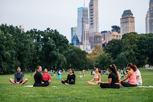 Exercising yoga in Central Park in NYC