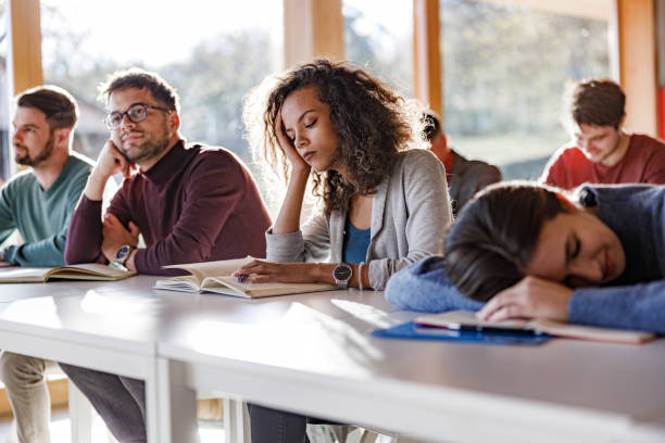 istock Bored female student on a class with her friends. 1757334973