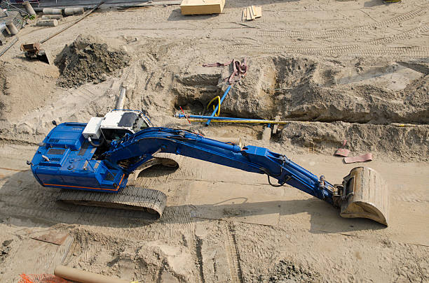 Blue excavator bulldozer at construction site stock photo