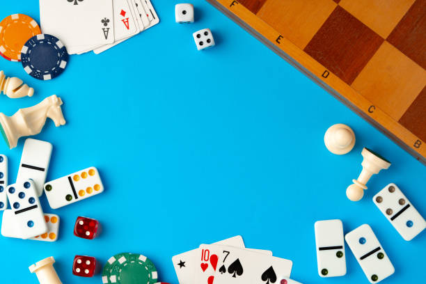 istock Items for playing chess, poker and domino on blue background studio shot 1757358290