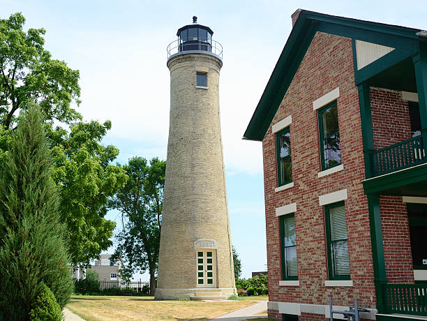istock Old Tan Brick Lighthouse and Lightkeeper's House 175736000