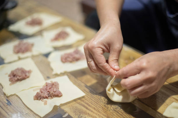 istock The dumpling making. Meat in dough. Cook prepares dumplings. 1757363031