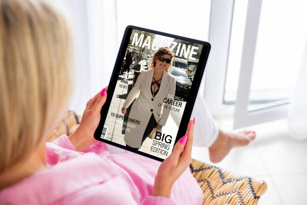 istock Woman reading magazine on tablet computer 1757369557