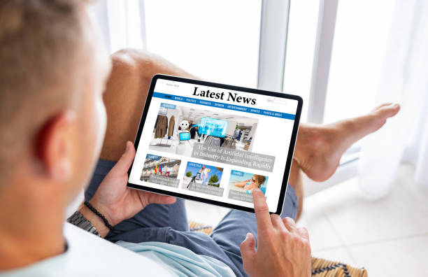 istock Man reading news website on digital tablet 1757369573