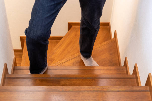 istock A person climbing wooden stairs 1757373486