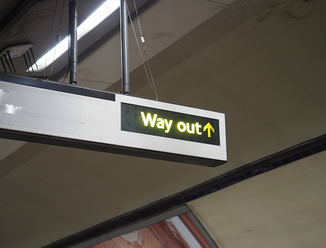 way out exit sign with direction arrow