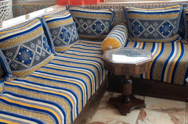istock Moroccan sofa with cushions and small ornate wooden table 1757384743