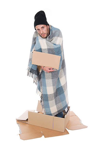 istock Homeless in his cardboard begging with a sign 175739115