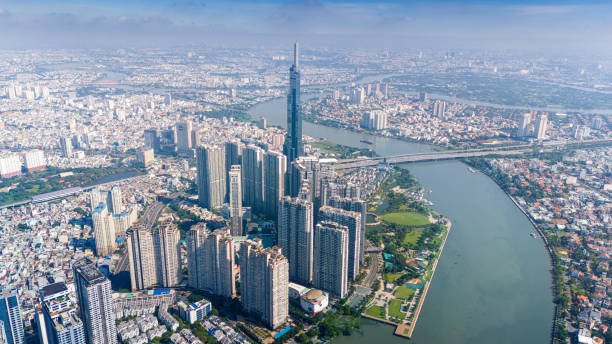aerial view of early morning at Landmark 81 is a super tall skyscraper in center Ho Chi Minh City, Vietnam and Saigon bridge with development buildings, energy power infrastructure. aerial view of early morning at Landmark 81 is a super tall skyscraper in center Ho Chi Minh City, Vietnam and Saigon bridge with development buildings, energy power infrastructure. Travel concept. ho chi minh city stock pictures, royalty-free photos & images