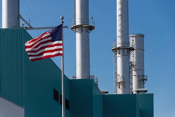 istock American Flag With Idle Industrial Smokestacks 175740911