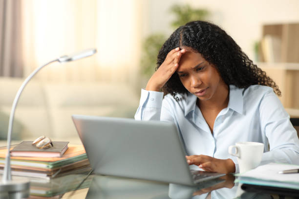istock Worried black tele worker checking laptop 1757418275