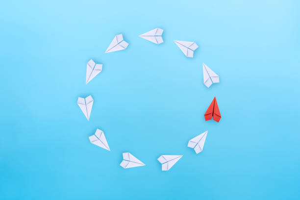 istock Business for new ideas creativity, innovative and solution concept. Group of paper planes in one direction with one individual is different on blue background. 1757419391