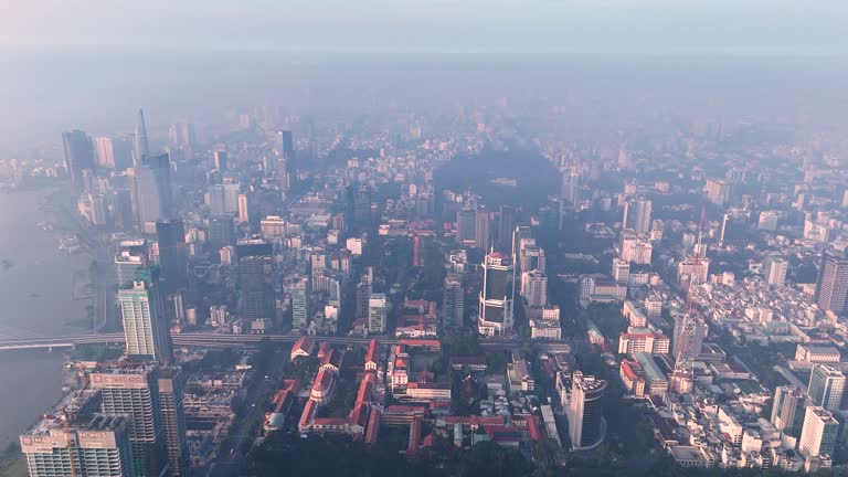Aerial view of Ho Chi Minh city skyline with buildings, roads, bridge and Saigon river in Vietnam in the morning.